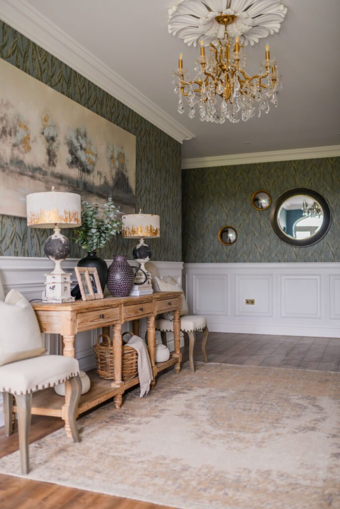 Elegant sitting room with double console tables, botanical wallpaper and gold chandelier – Cloyne Farmhouse Part Two project, designed by AK Interior, Cork, Ireland.