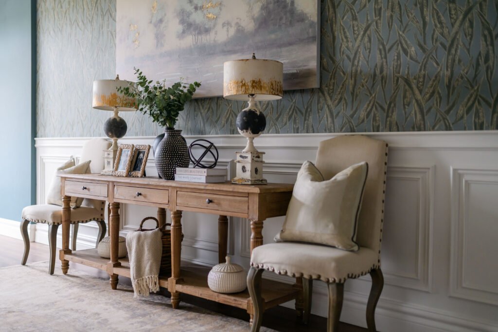 Full console table scene with sculptural objects, framed photos and neutral seating – Cloyne Farmhouse Part Two project, designed by AK Interior, Cork, Ireland.