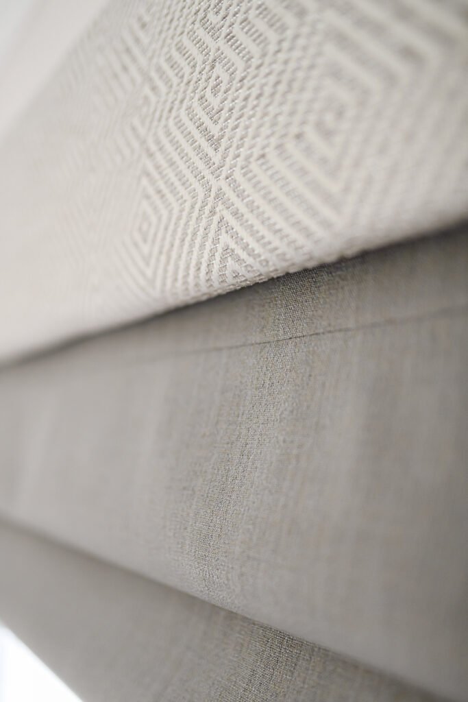Close-up of textured grey upholstery and soft neutral cushions – Cloyne Farmhouse Part One project, designed by AK Interior, Cork, Ireland.