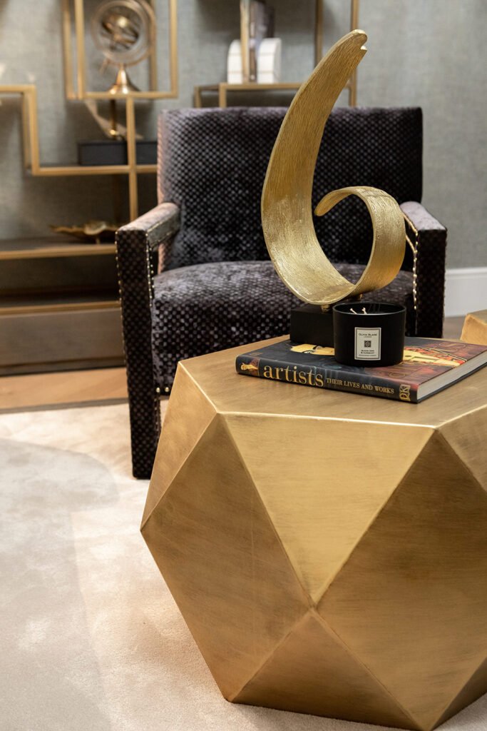 Decorative table details: book, candle, and sculpture – Blarney Residential, AK Interior, Cork