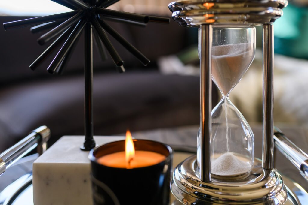 Tray with black starburst ornament, hourglass and candle on coffee table, Rathmore Residential project, AK Interior, Cork.
