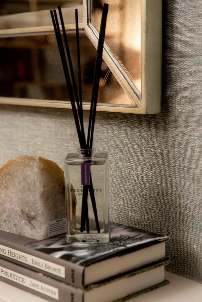 Reed diffuser placed on books with a decorative geode detail – Blarney Residential, AK Interior, Cork