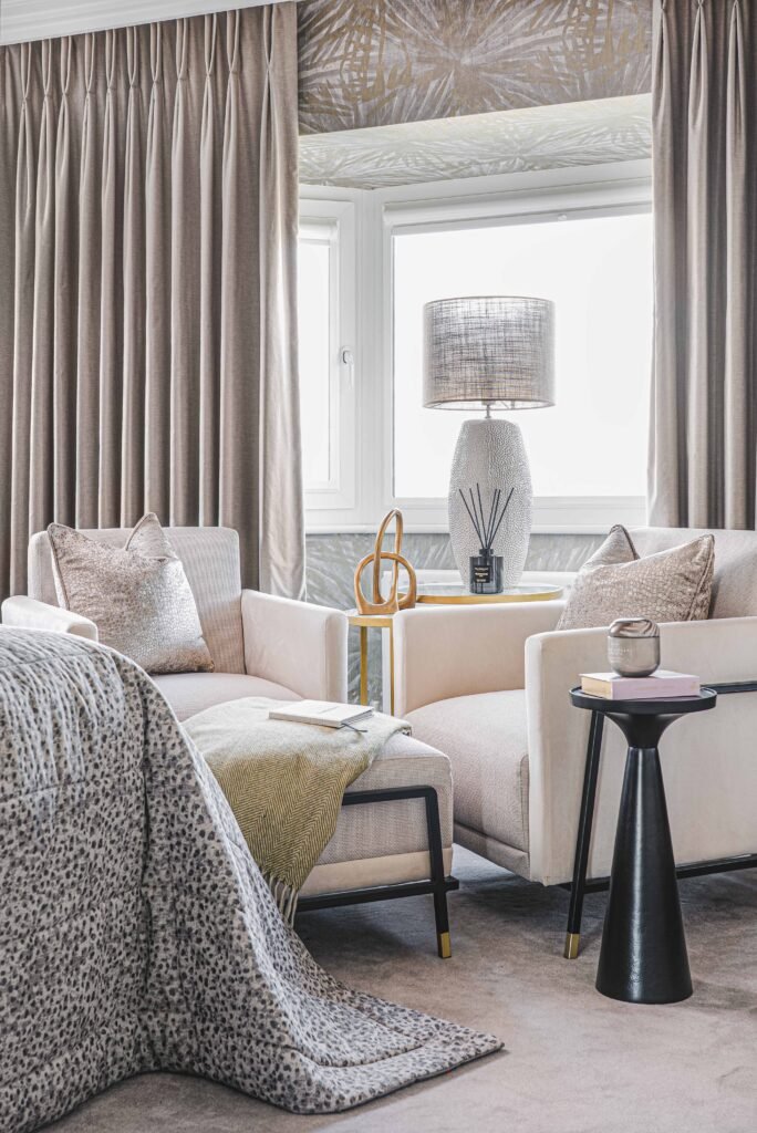 Armchair by large window with floor-length curtains and ceramic table lamp – Douglas Part One project, designed by AK Interior, Cork, Ireland.