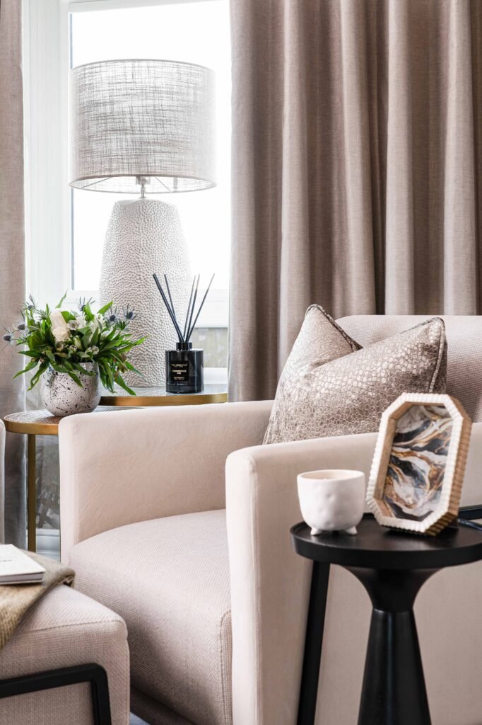 Close-up of round side table with ceramic lamp and gold decorative sculpture – Douglas Part One project, designed by AK Interior, Cork, Ireland.