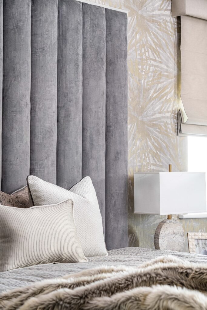 Grey fluted headboard with layered cushions and soft neutral curtains – Douglas Part One project, designed by AK Interior, Cork, Ireland.