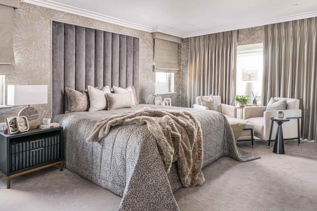 Cozy bedroom with textured headboard, layered bedding and soft neutral decor – Douglas Part One project, designed by AK Interior, Cork, Ireland.