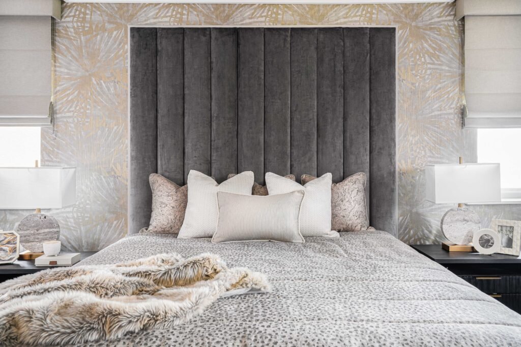 Cozy bedroom with fluted headboard, neutral bedding and matching bedside lamps – Douglas Part One project, designed by AK Interior, Cork, Ireland.