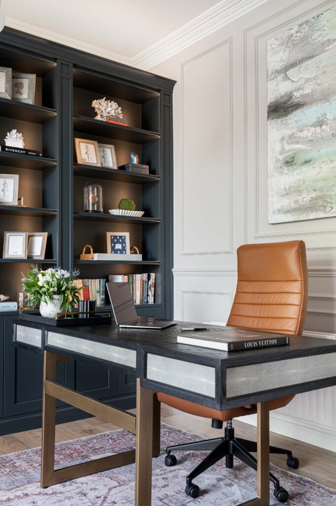 Office desk with a leather chair and dark shelving in the background – Douglas Part Two, AK Interior, Cork