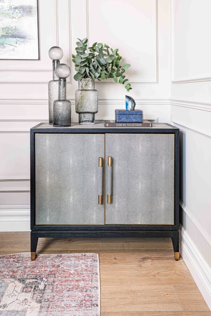 Console table with decorative vases and a Louis Vuitton book – Douglas Part Two, AK Interior, Cork