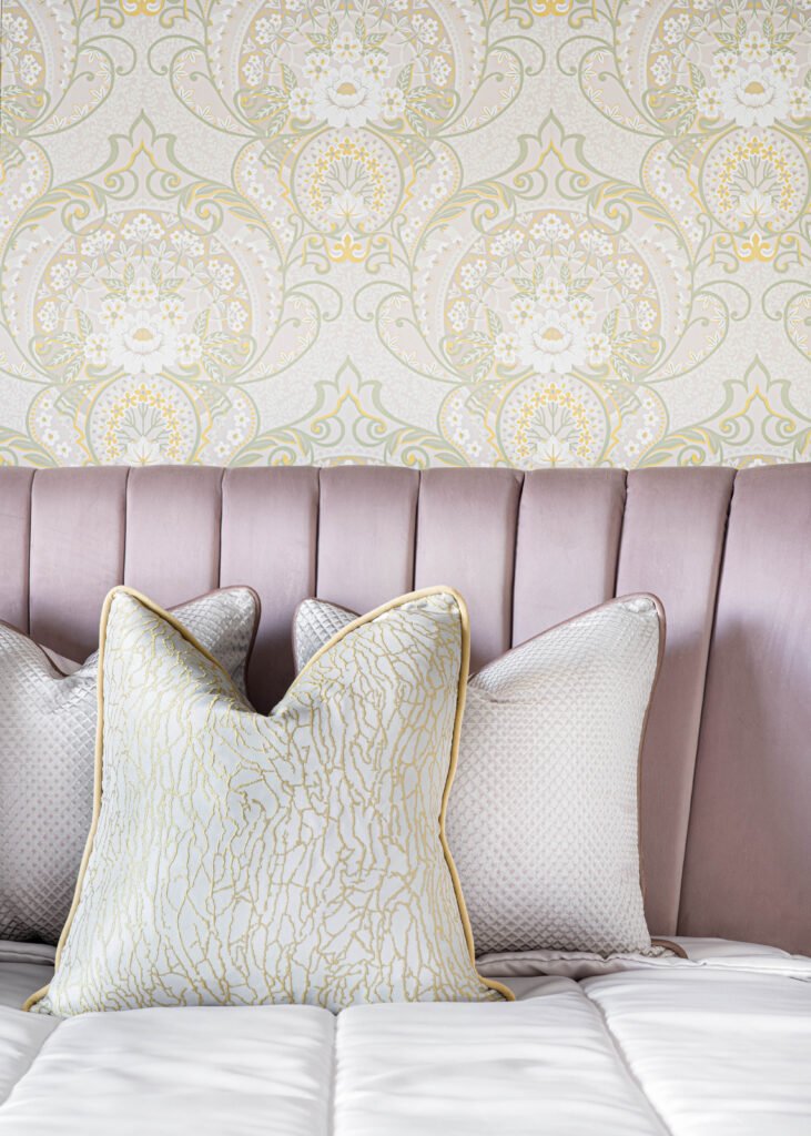 Decorative cushions on a velvet headboard with patterned wallpaper – Douglas Part Two, AK Interior, Cork