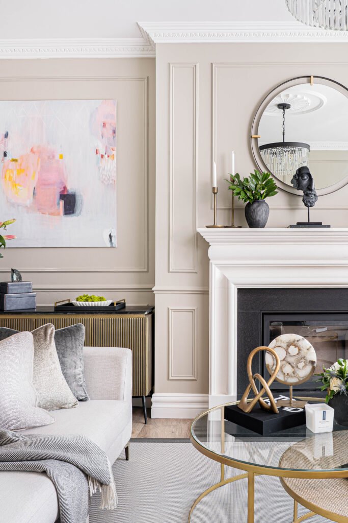 Fireplace with round mirror and a curated selection of decor items – Douglas Part Two, AK Interior, Cork