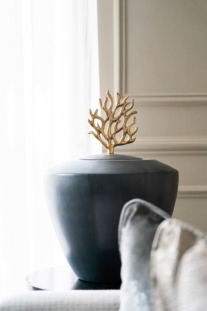 Grey decorative jar with a gold coral detail on a side table – Douglas Part Two, AK Interior, Cork