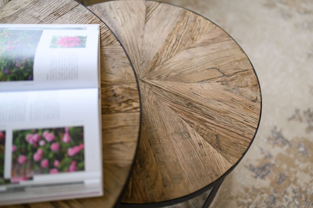 Open book on round wooden coffee table with rustic texture – Cloyne Farmhouse Part One project, designed by AK Interior, Cork, Ireland.