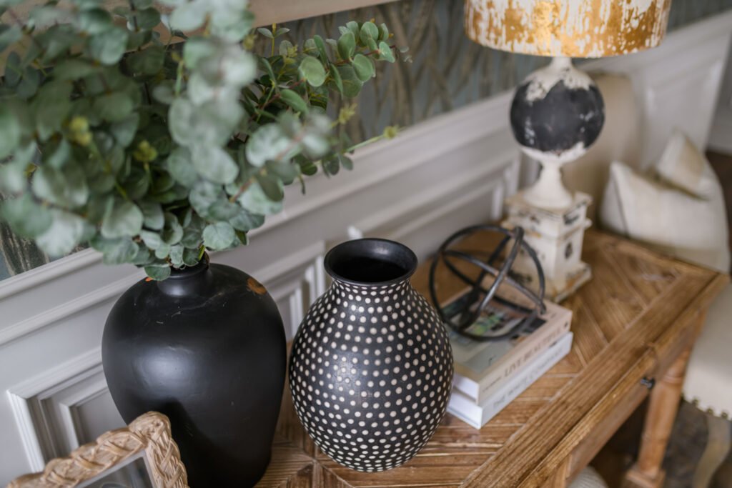 Close-up of decorative black vase with greenery on textured console – Cloyne Farmhouse Part Two project, designed by AK Interior, Cork, Ireland.