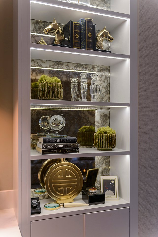 Decorative shelving with books, glass decor, gold accessories, and LED lighting. City Townhouse Residential project, AK Interior, Cork.