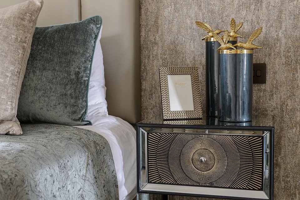Bedside table with gold decorative vase and metallic textured wall behind. City Townhouse Residential project, AK Interior, Cork.