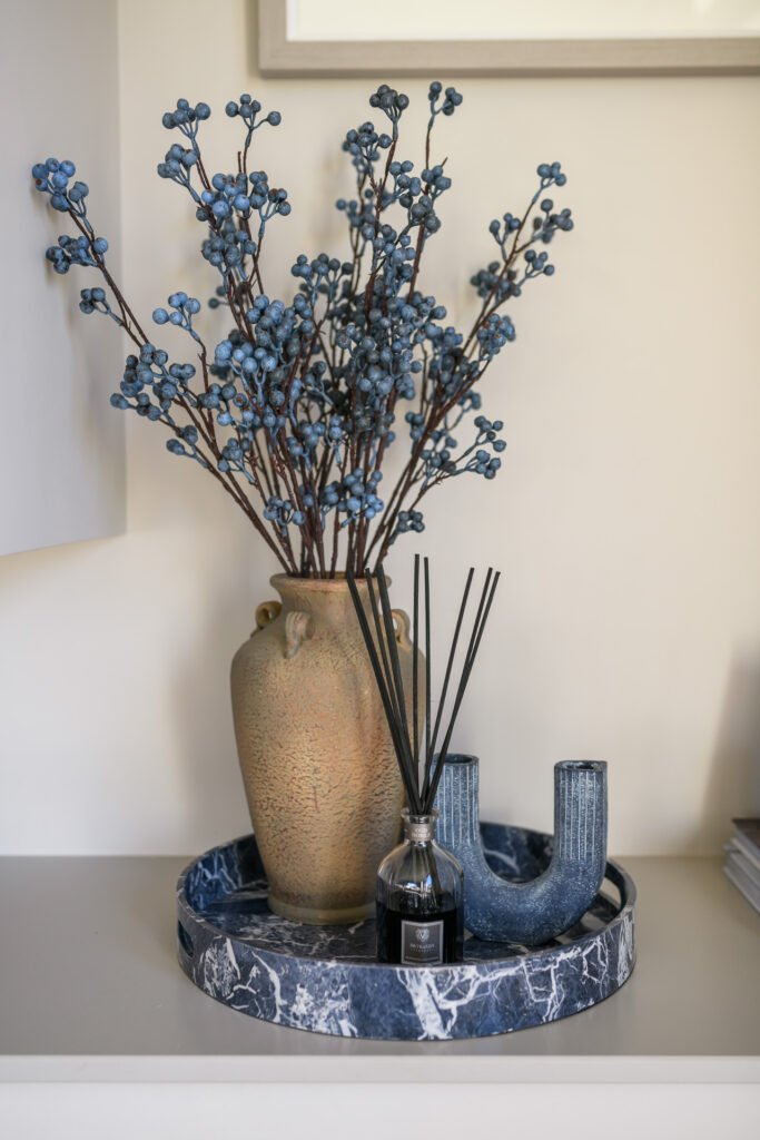 Shelf vignette with ceramic vase, blue berry stems and reed diffuser on marble tray, Rathmore Residential project, AK Interior, Cork.