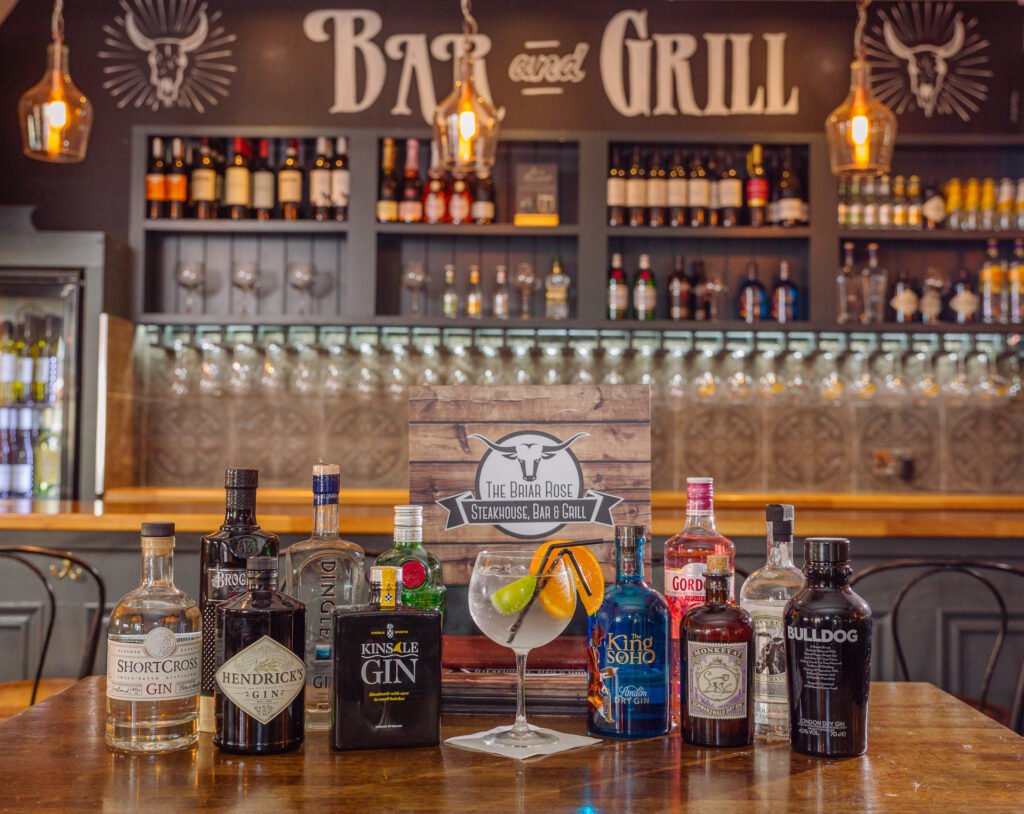 Intimate dining nook with curved banquette seating and framed artwork. Briar Rose Commercial project, AK Interior, Cork.