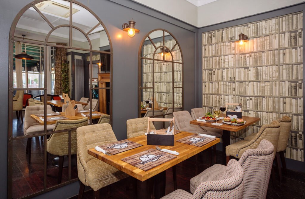 Bar counter detail with beer taps, branded signage and bottle display. Briar Rose Commercial project, AK Interior, Cork.