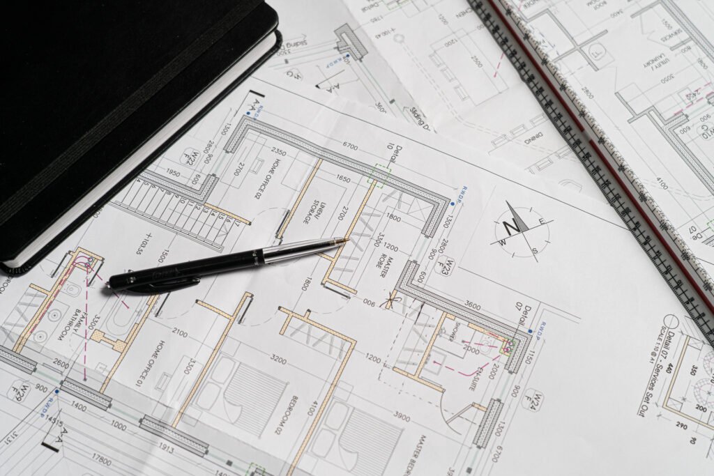 Architectural floor plans with measurement tools and drafting pens | interior design services by AK Interior, Cork Ireland