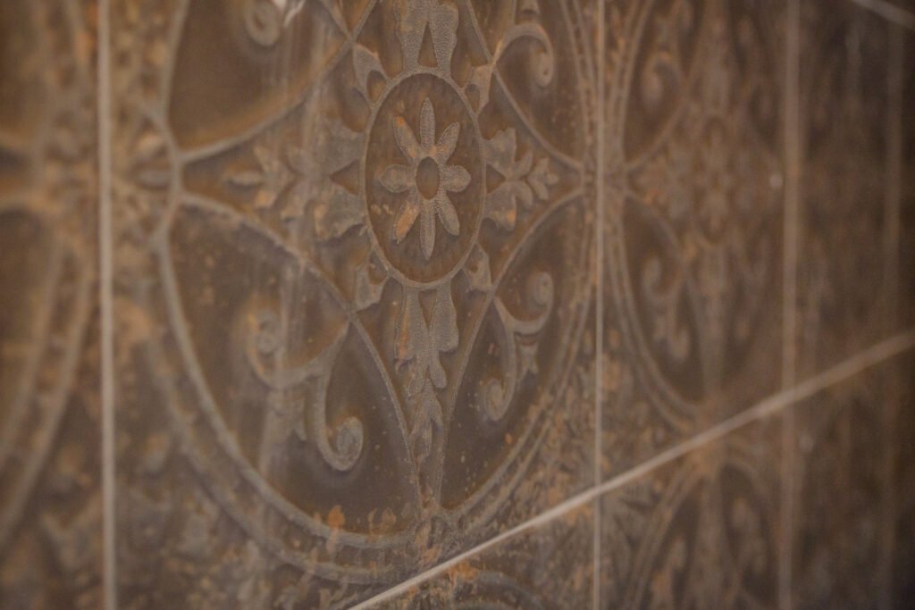 Detail of patterned wall tiles and textured wallpaper in dining area. Briar Rose Commercial project, AK Interior, Cork.