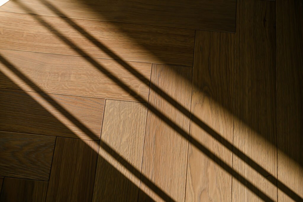 Morning sunlight casting shadows on herringbone timber floor, Rathmore Residential project, AK Interior, Cork.