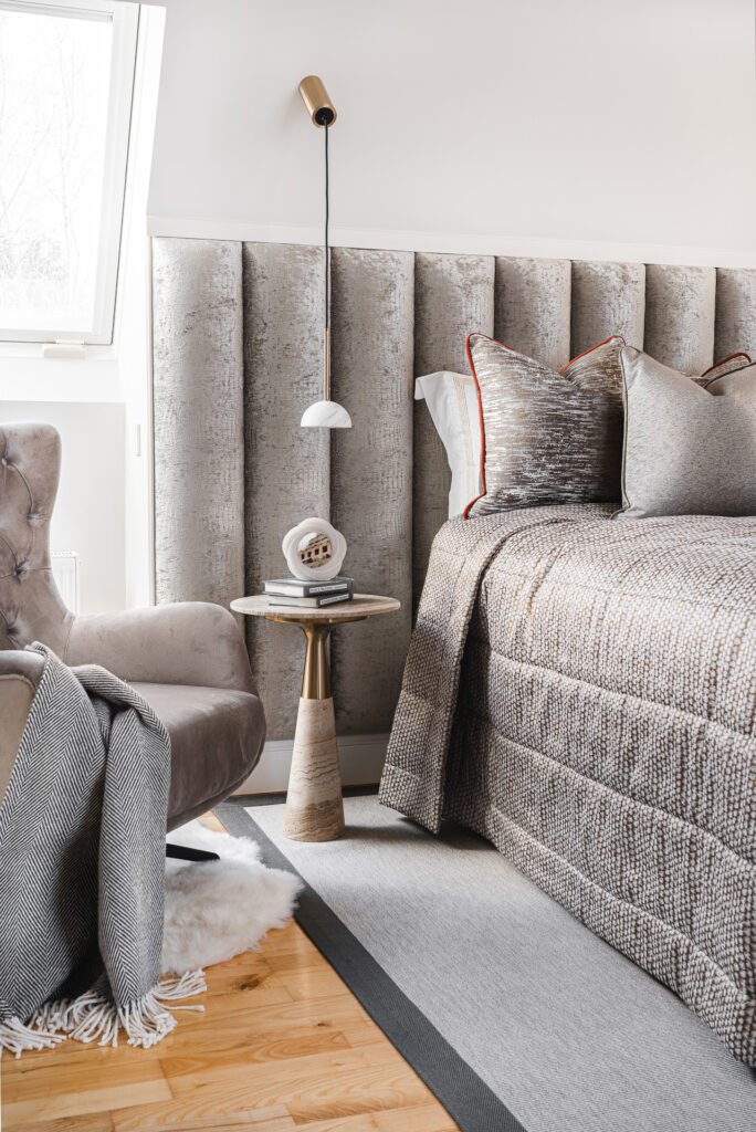 Bedroom area with bed and velvet chair – Moneygurney Road Part One, AK Interior