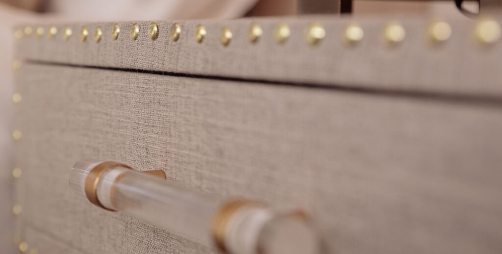 Close-up of textured drawer front with gold stud detailing and acrylic handle – Innishannon Showhouse by AK Interior, Cork Ireland.