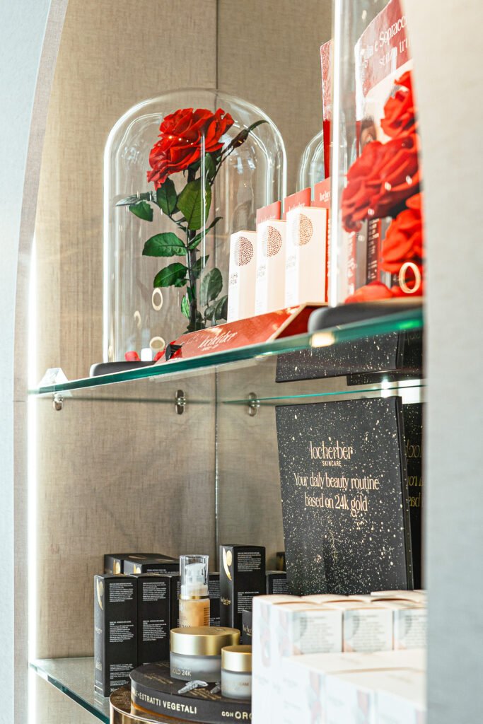 Glass display shelves with preserved red roses and luxury beauty products – Bon Me project, designed by AK Interior Cork.