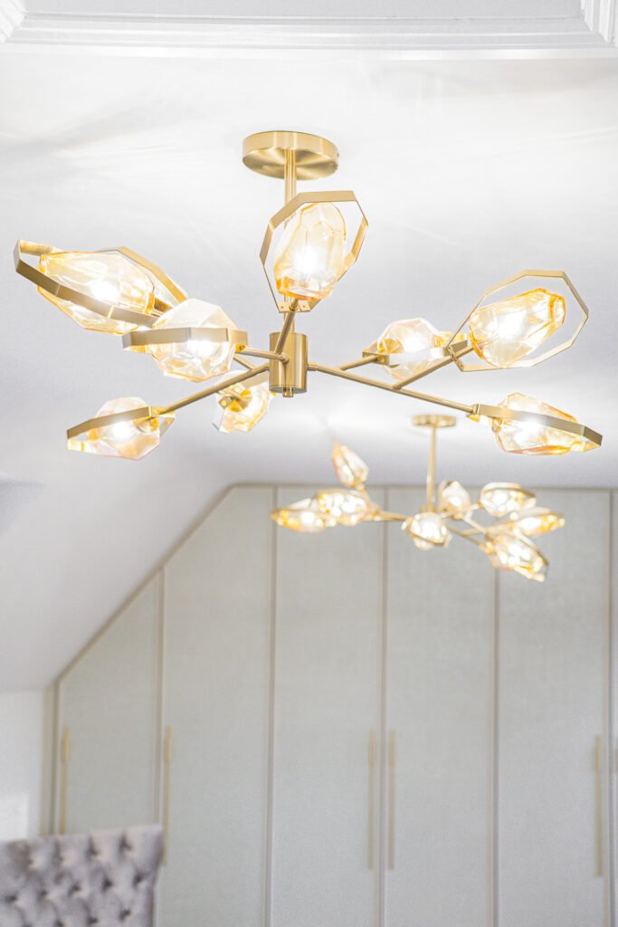 Two golden modern chandeliers in the bedroom interior – Moneygurney Road Part One, AK Interior