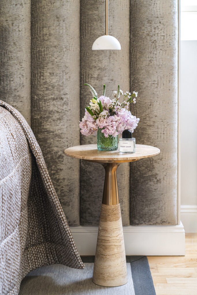 Bedside table with flowers and a pendant lamp – Moneygurney Road Part One, AK Interior