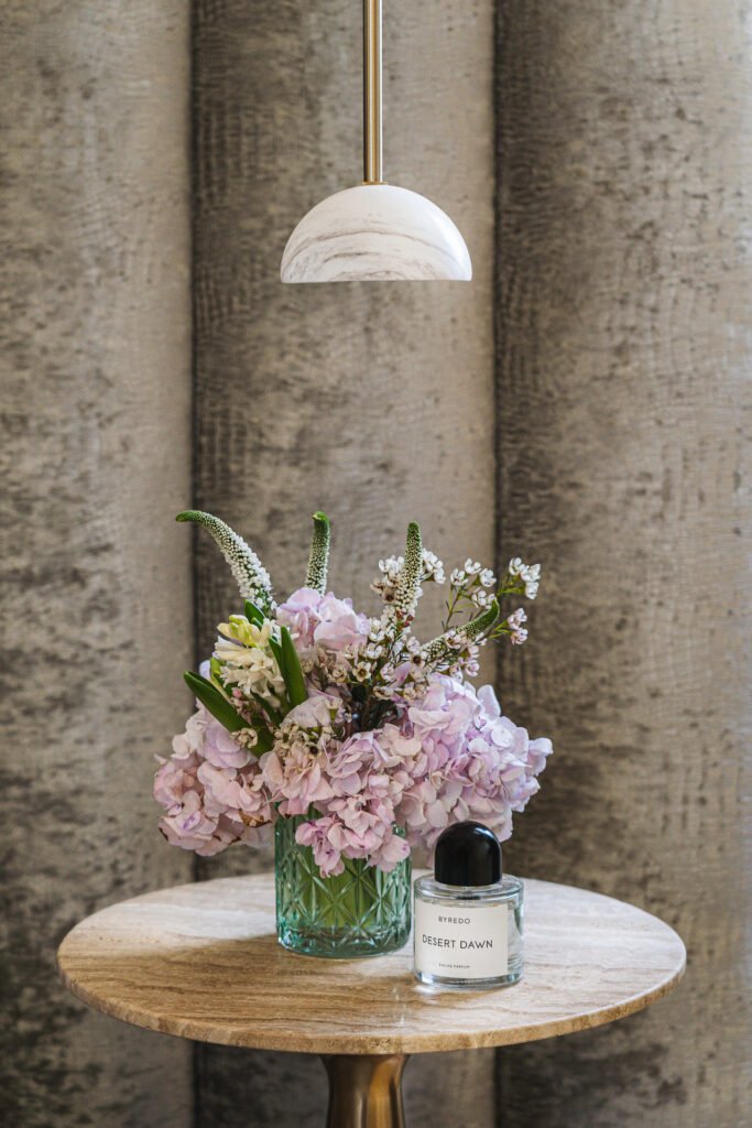 Bedside table with flowers and fragrance – Moneygurney Road Part One, AK Interior