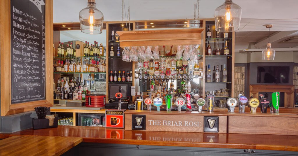 Back bar shelving with timber framing, glassware and spirits on display. Briar Rose Commercial project, AK Interior, Cork.