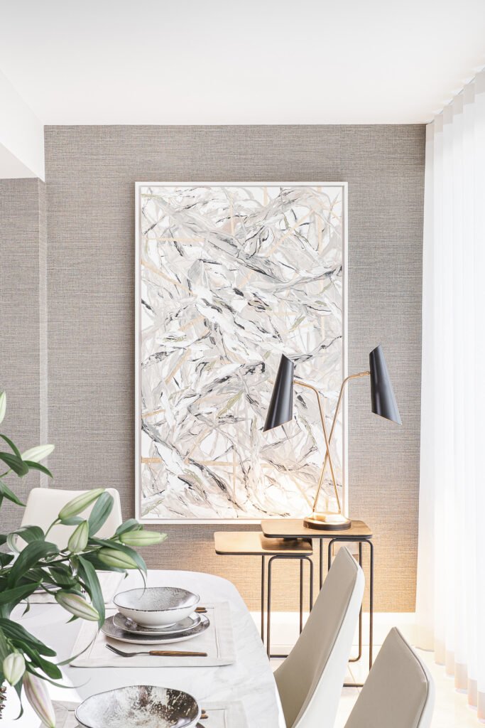 Textured wall with large decorative artwork and table lamp – Luxury Living Room Part Two by AK Interior.