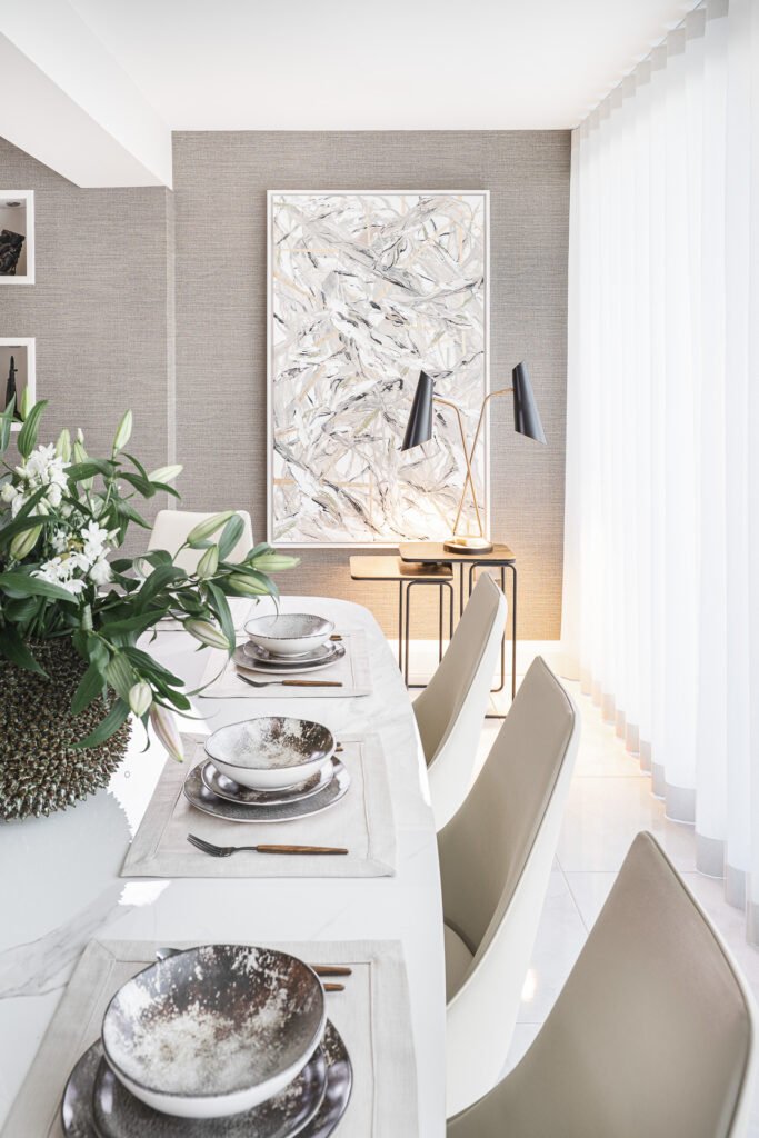 Elegant dining table setting with ceramic plates and wooden cutlery – Luxury Living Room Part Two by AK Interior.