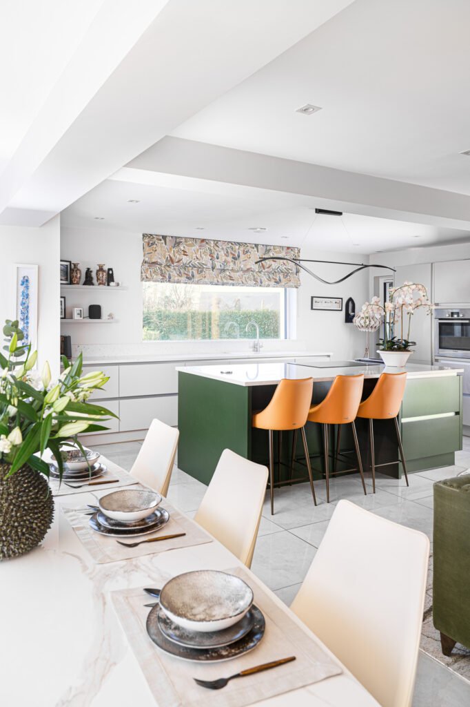 Contemporary dining setup with modern tableware and green centerpiece – Luxury Living Room Part Two by AK Interior.