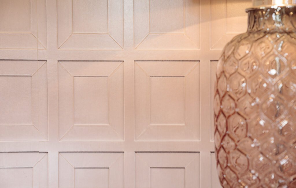 Textured wall panelling with decorative glass lamp in foreground – Innishannon Showhouse by AK Interior, Cork Ireland.