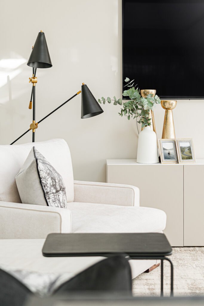 Black triple-head floor lamp next to console – Moneygurney Road Part One, AK Interior