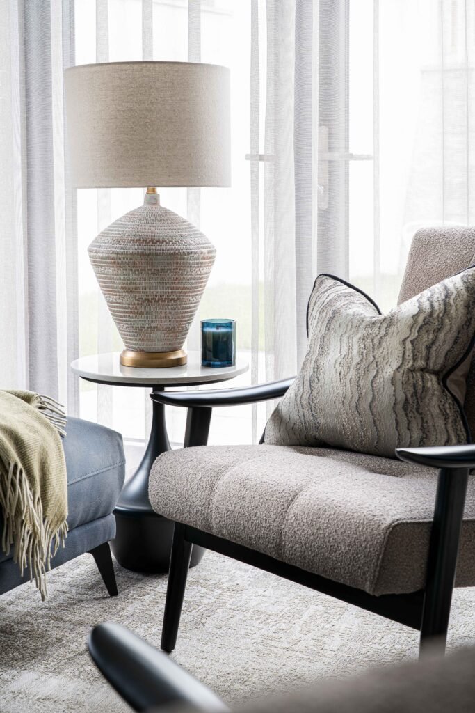 Close-up of ceramic table lamp and blue sofa in soft natural light – Residential project “The Steeples Part One”, designed by AK Interior, Cork, Ireland.