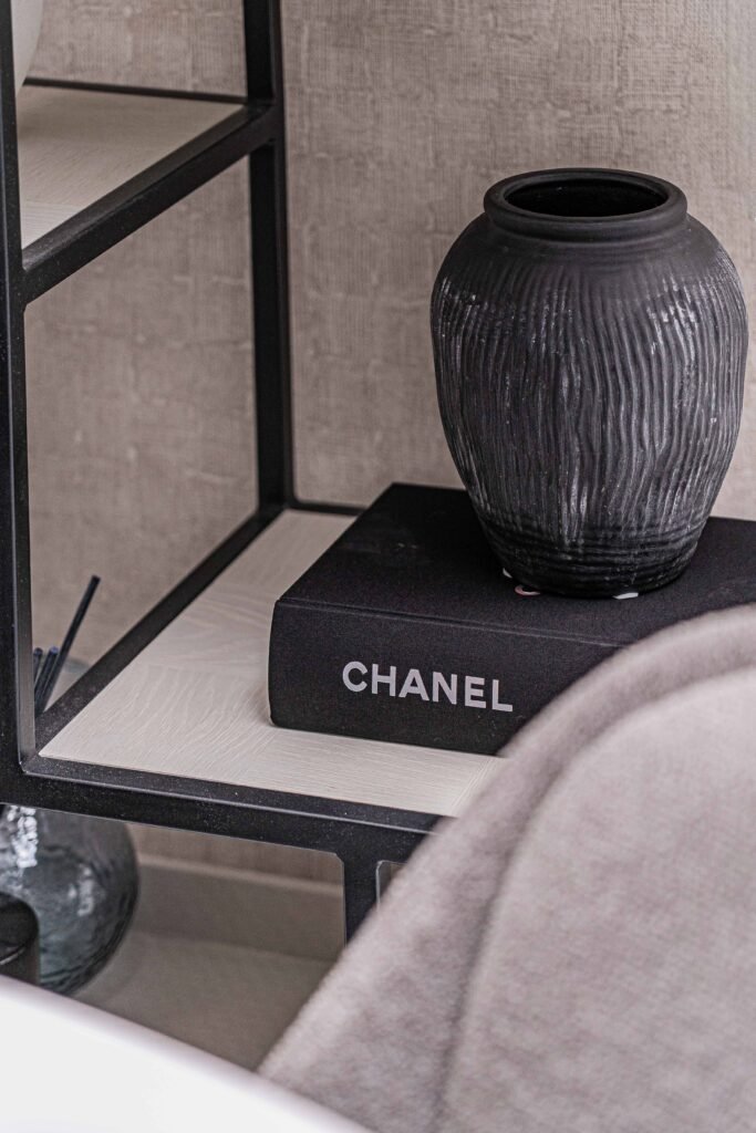 Chanel decor book with textured black vase on modern shelving – Residential project “The Steeples Part One”, designed by AK Interior, Cork, Ireland.