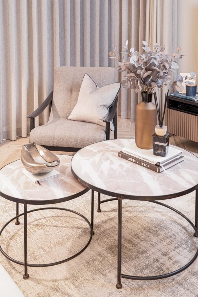 Close-up of dried floral arrangement in ceramic vase on soft furnishings — The Steeples Part One by AK Interior