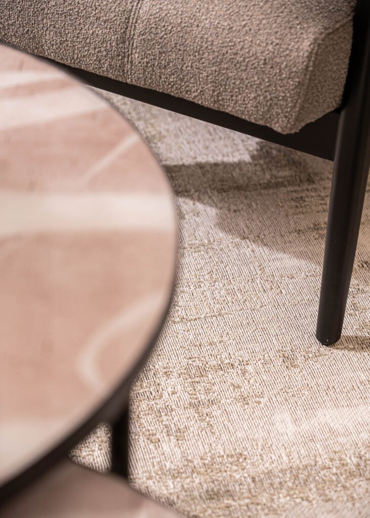 Close-up coffee table decor with metallic tray and modern sculpture — The Steeples Part One by AK Interior