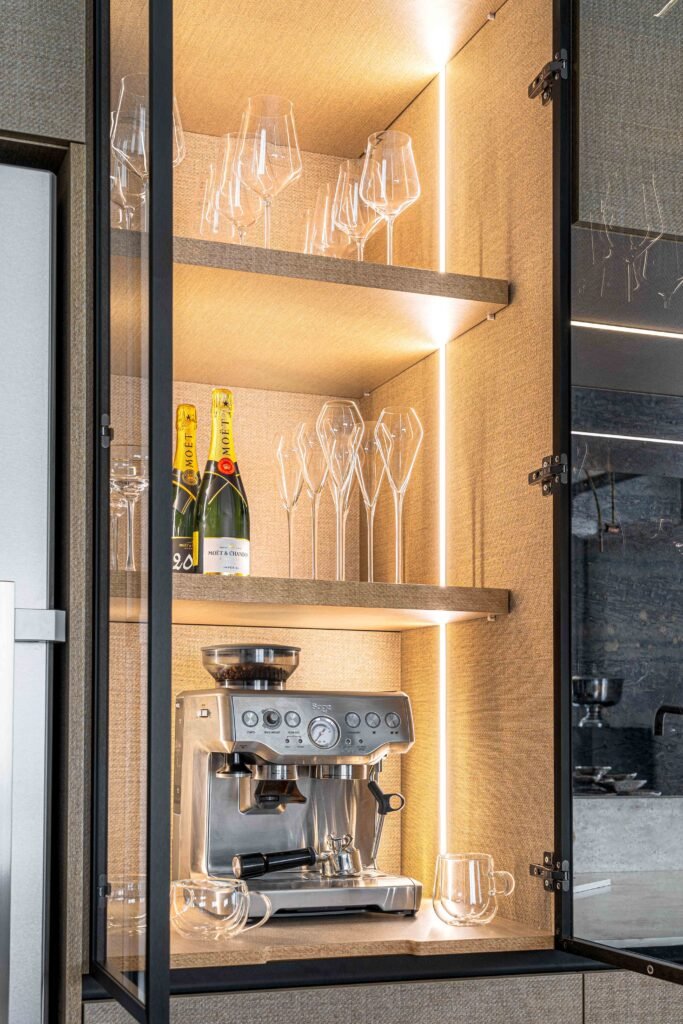 Open kitchen display cabinet with glassware and espresso machine | Monkstown Full House Design | AK Interior