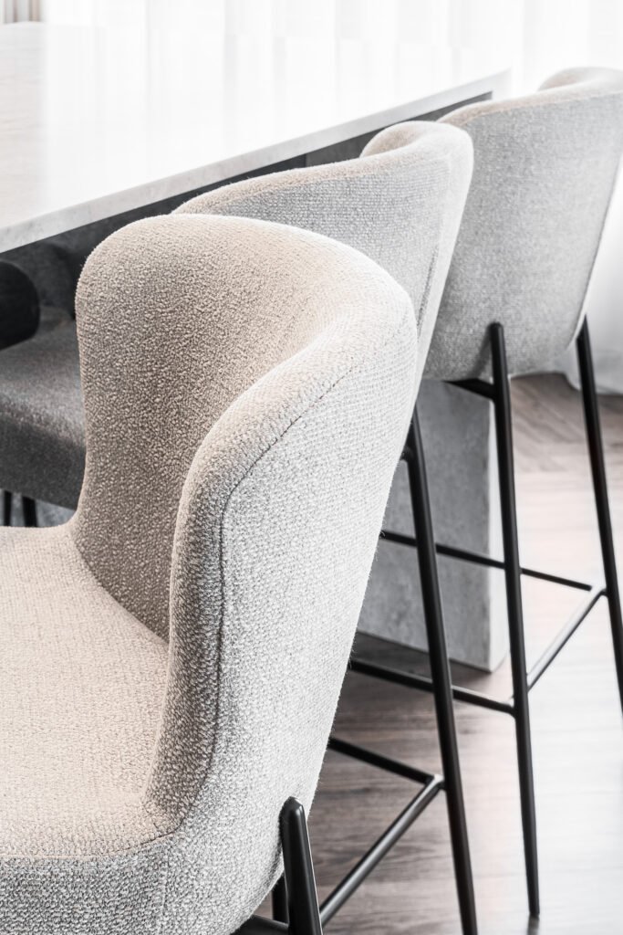 ight fabric bar stools lined up at the kitchen island | Monkstown Full House Design | AK Interior