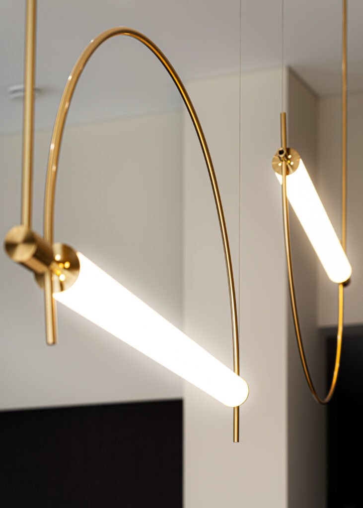 Modern gold arc pendant lights in the kitchen | Monkstown Full House Design | AK Interior