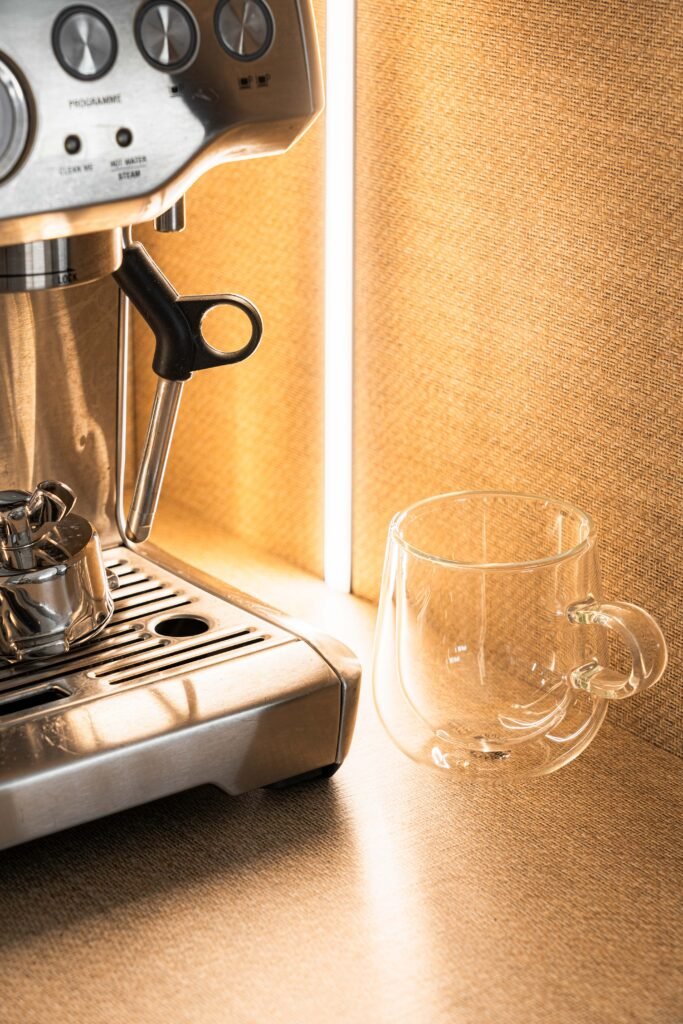Espresso machine with a glass cup on a backlit kitchen shelf | Monkstown Full House Design | AK Interior