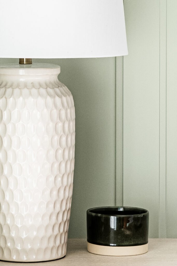 Detail of bedside table with textured ceramic vase and decor – West Cork Waterfront, residential project by AK Interior, Cork, Ireland.