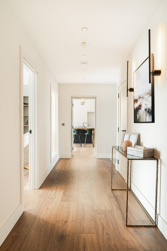 Bright hallway with wall sconces and console table – Dingle project, designed by AK Interior, Cork, Ireland.