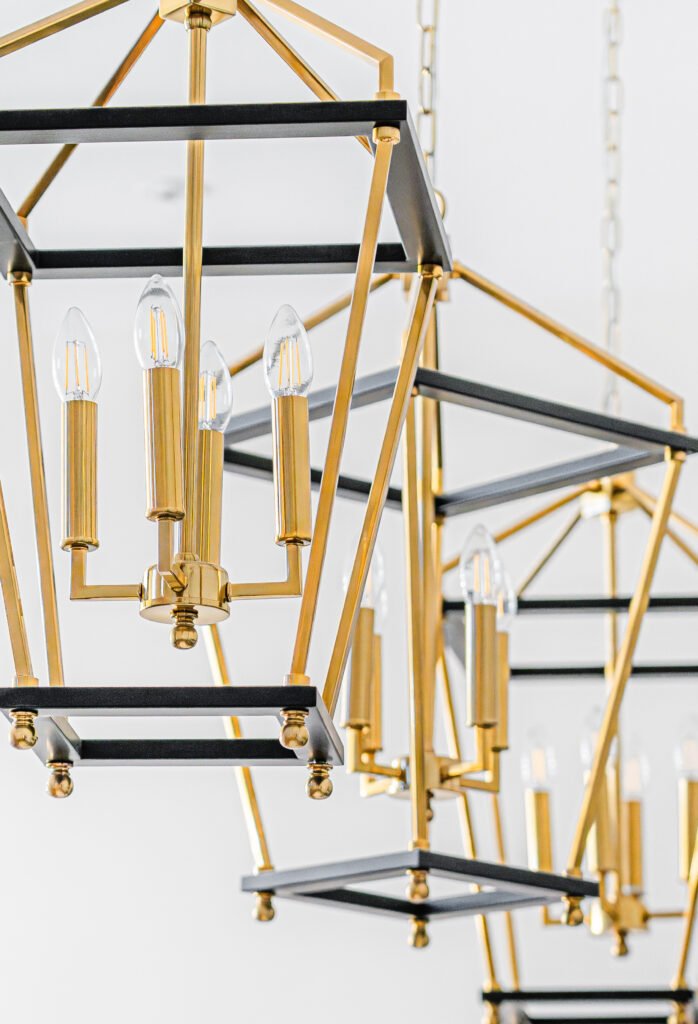 Gold geometric pendant lights above kitchen island – Dingle project, designed by AK Interior, Cork, Ireland.