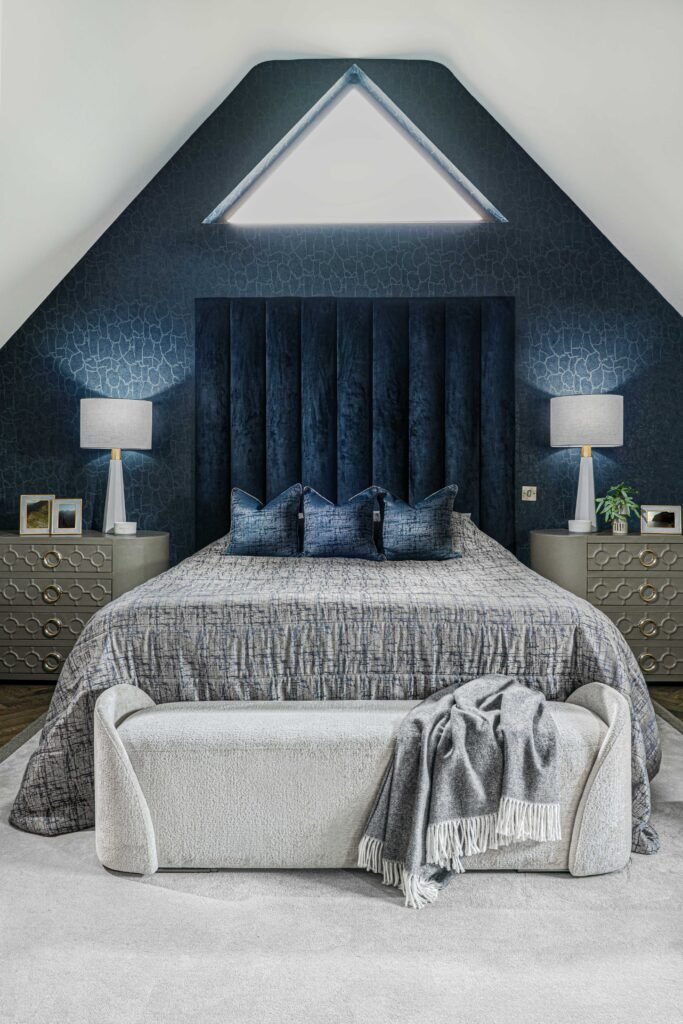 Dark navy attic bedroom with tall velvet headboard, double bed and soft light rug – Youghal Residential, AK Interior, Cork